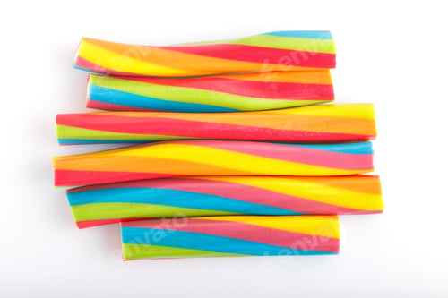 Preview: rainbow chewing caramel sugar candies. isolated on white.