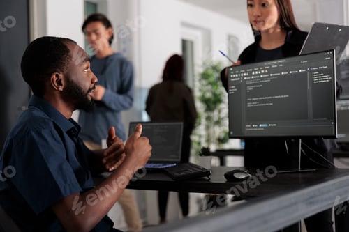 Preview: Diverse group of web developers analyzing html code and comparing data script