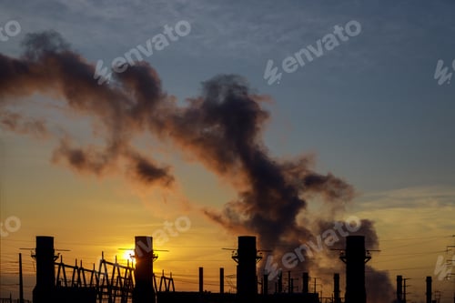 Preview: panorama at morning with steam from a power station coal power plant at sunrise