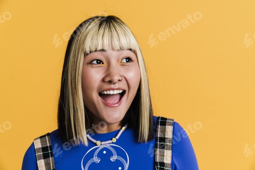 Preview: Asian girl with piercing laughing and looking aside