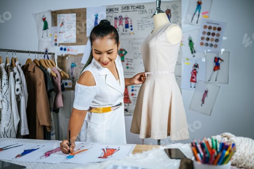 Preview: Young Asian Fashion Designer female in tailor shop
