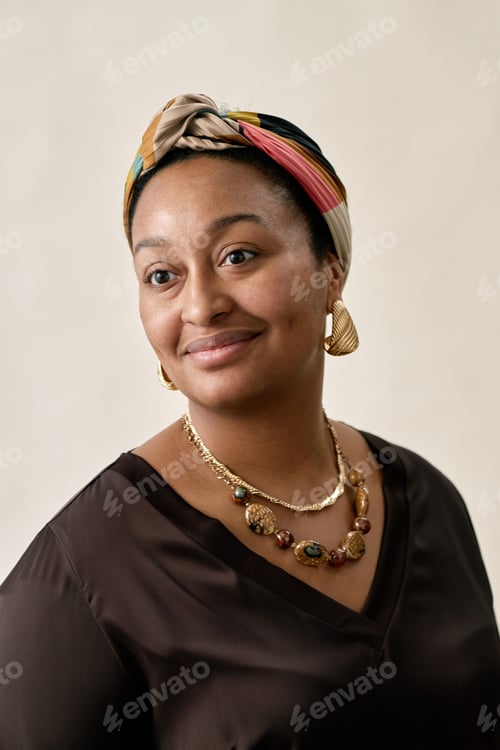 Preview: Portrait of Smiling Woman Wearing Headscarf Posing in Studio