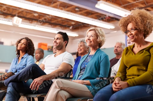 Preview: Group Attending Neighborhood Meeting In Community Center