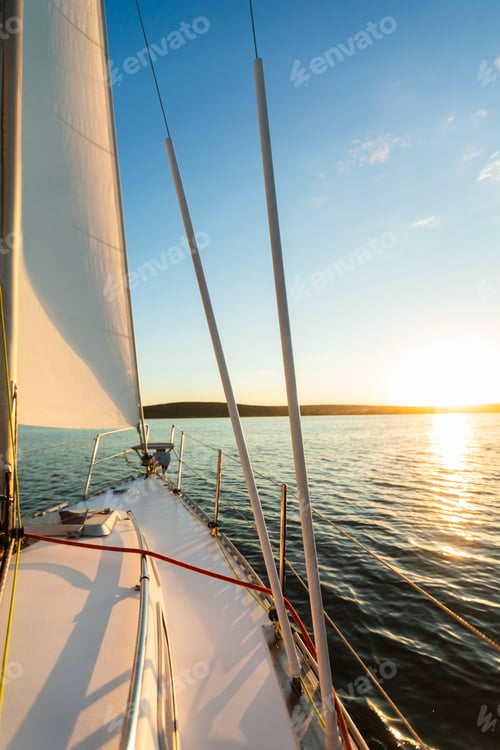 Preview: Yacht Sailing In Sea At Sunset On Summer Day, Vertical