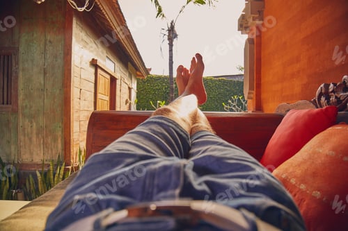 Preview: Man'S Legs On A Porch Sofa In Summertime.