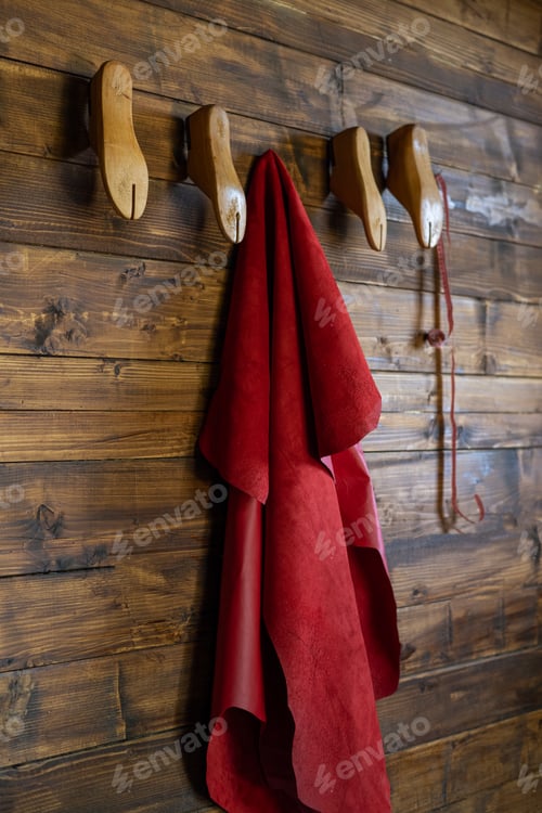 Preview: Rustic Wooden Wall with Wooden Hooks and Red Cloth