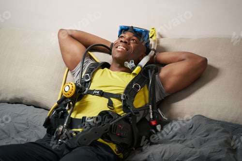 Preview: Joyful man enjoying rest in scuba diving suit