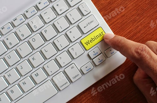 Preview: Finger pressing yellow label keyboard with text WEBINAR