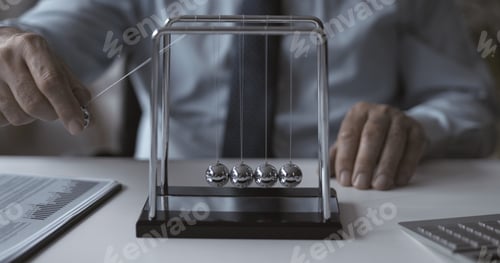 Preview: Corporate businessman and Newton's cradle