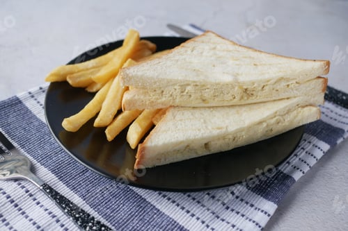 Preview: egg sandwich and chips on plate close up