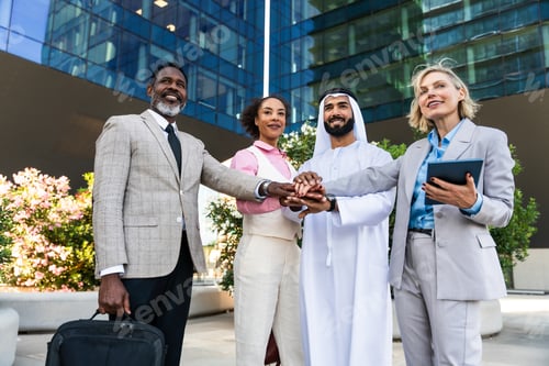Preview: Group of multiethnic business people meeting an emirati businessman