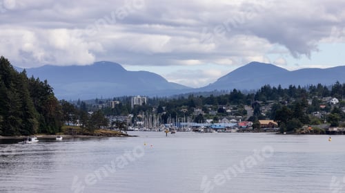 Preview: City by the water, Marina with Boats, surrounded by Homes, mountains and trees. Summer Season.