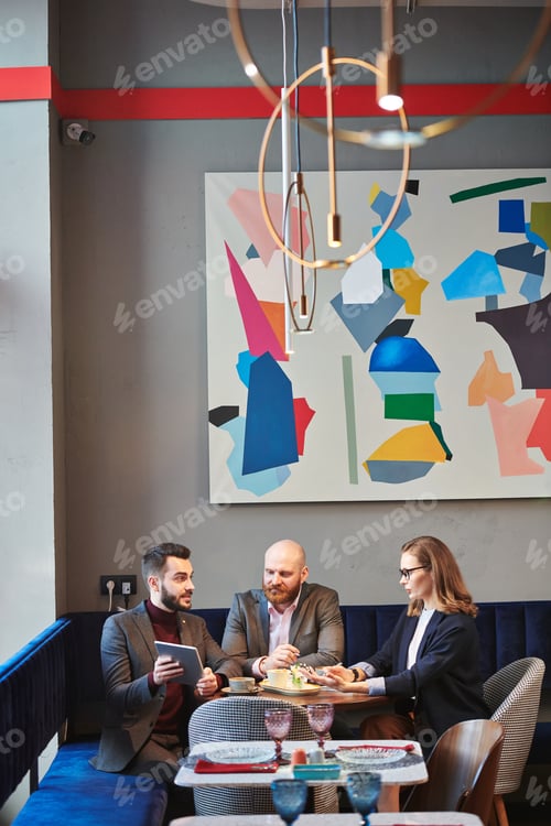 Preview: Presenting creative project at meeting in cafe
