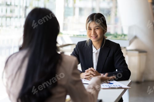 Preview: Businesswoman discussing with colleagues in the office, job interview.
