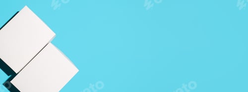 Preview: Two closed white boxes on a blue background, top view. Mockup banner, copy space