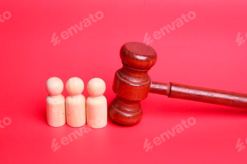 Preview: court hammer Or judge gavel and wooden statue.