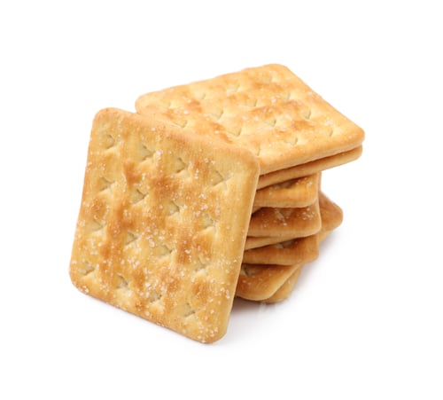 Preview: Stack of tasty salty crackers isolated on white