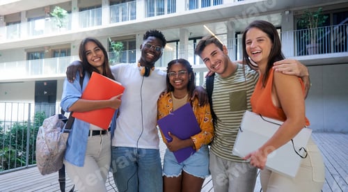 Preview: Portrait of happy group of multiethnic students in the school looking at camera smiling.