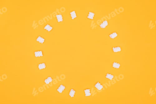 Preview: top view of circle of marshmallows isolated on orange