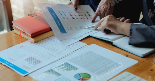 Preview: Two accountant discussion analysis sharing calculations about the company budget and financial