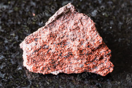 Preview: sample of rough analcimolite rock on black granite