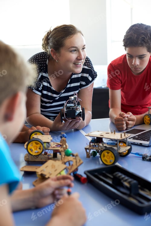 Preview: Students In After School Computer Coding Class Building And Learning To Program Robot Vehicle