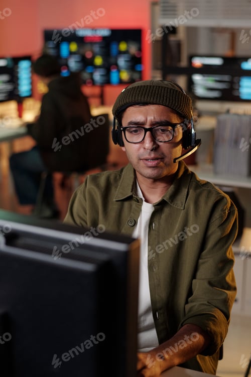 Preview: South Asian Man Wearing Headset Coordinating Scam Call Center Activity