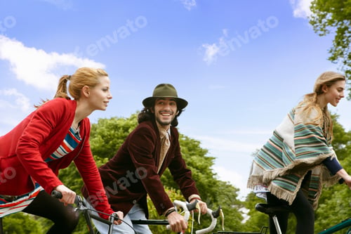 Preview: Teenagers riding bicycles in park