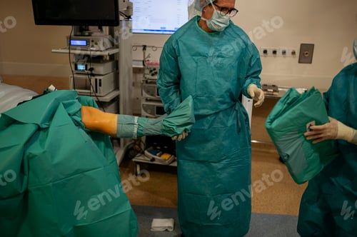 Preview: Team of surgeons operating in the hospital. Healthcare concept