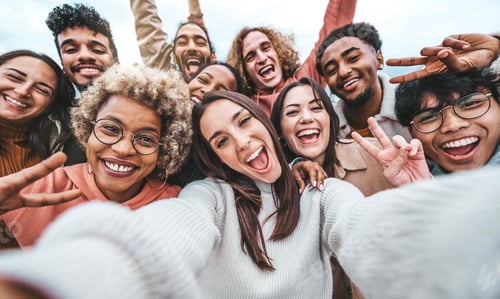 Preview: International group of young people laughing at camera outside