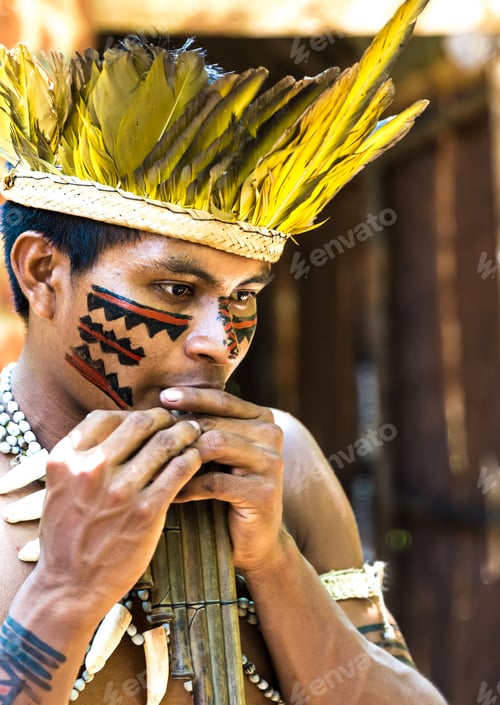 Preview: Native Brazilian Guy Playing Wooden Flute At An Indigenous Tribe In The Amazon