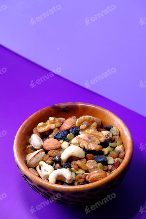Preview: Nuts and Seeds Bowl on Purple Background