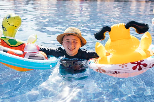 Preview: Portrait of boy in outdoor swimming pool