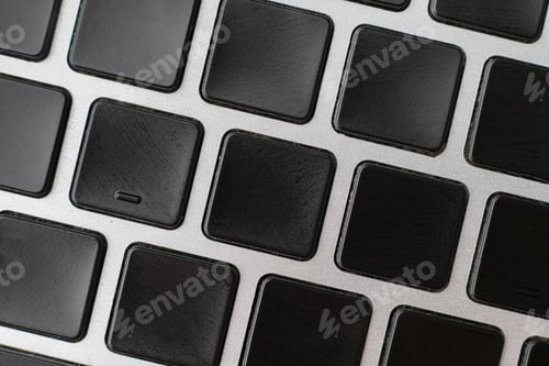 Preview: macro shot of empty blank keys on a keyboard without letter