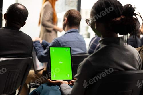 Preview: Vertical green screen tablet held by person at corporate business forum