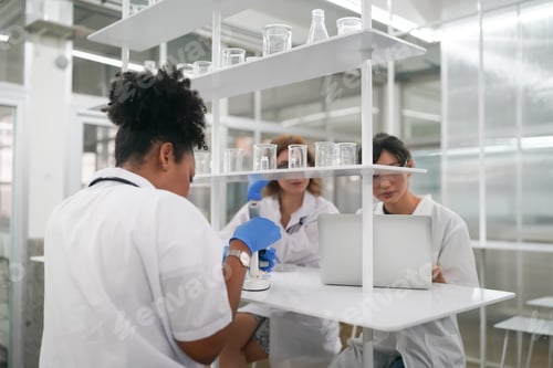 Preview: Scientist holding scientific experiment in the lab