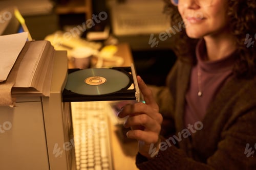 Preview: Caucasian Woman Inserting Disc into Computer Optical Drive