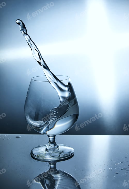 Preview: Glass of water with a wave on a blue background