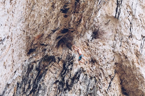 Preview: Anonymous man climbing rock