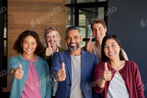 Preview: Portrait of successful and smiling business team with thumbs up