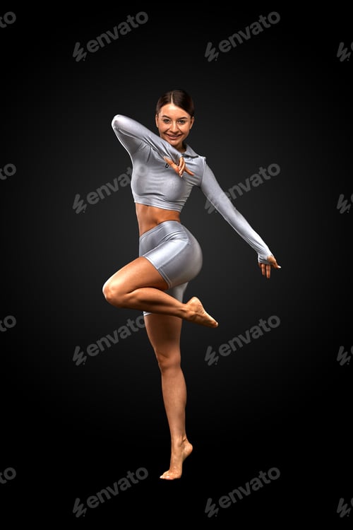 Preview: sexy brunette girl with a slim figure in leggings posing in studio on a black background
