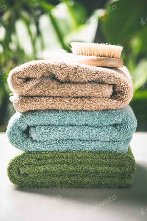 Preview: Towels on tropical leaves background