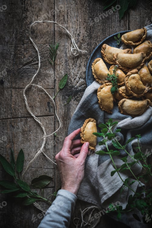 Preview: Crop person serving golden pies