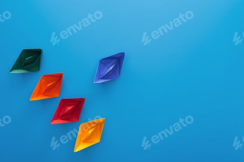 Preview: Flat lay with colorful paper boats on blue surface