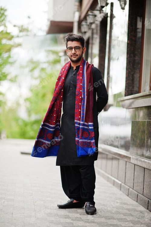 Preview: Pakistano bangladesh man wear black traditional clothes and eyeglasses pose outdoor.
