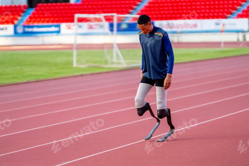 Preview: Asian para-athletes with prosthetic blades sprint on a running track at stadium.