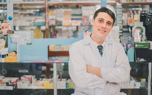 Preview: Male pharmacist posing confidently welcoming, advising patients