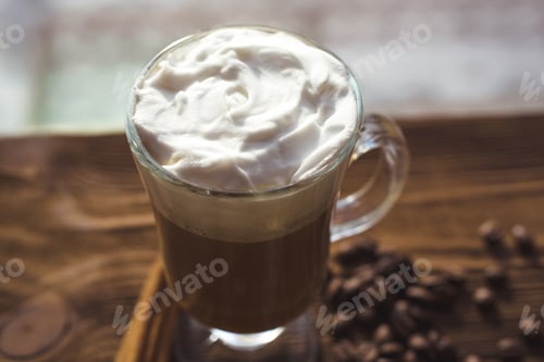 Preview: Cappuccino And Coffee Beans, Cinnamon. Background Roasted Coffee Beans Close-Up. Coffee Beans With