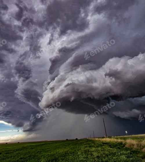 Preview: Majestic storm clouds loom over a serene landscape.