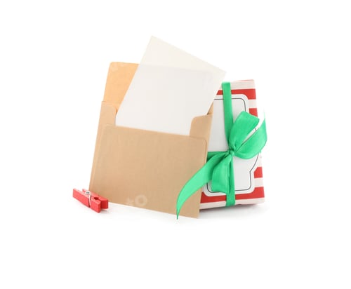 Preview: Blank greeting card in envelope, Christmas gift and clothespin on white background, space for text